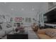 Bright living area with hardwood floors, recessed lighting, and a view into the kitchen at 1001 Manchester Dr, Raleigh, NC 27609