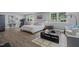 Spacious main bedroom featuring hardwood floors, neutral paint, and a cozy sitting area at 1001 Manchester Dr, Raleigh, NC 27609