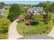 Stunning aerial view of a beautifully landscaped home with a circular driveway at 1008 Maduro Ct, Zebulon, NC 27597