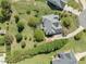 Aerial view of the property showcasing the home, landscaping, and surrounding area at 1008 Maduro Ct, Zebulon, NC 27597