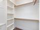 Walk-in closet with built-in shelves and hanging rods for optimal storage at 1008 Maduro Ct, Zebulon, NC 27597