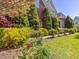 Beautiful brick home exterior with manicured landscaping and flowering trees at 1008 Maduro Ct, Zebulon, NC 27597