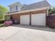 This brick home has an attached two car garage and beautiful landscaping at 1008 Maduro Ct, Zebulon, NC 27597