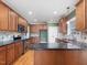 Well-equipped kitchen features granite countertops, stainless steel appliances, and ample cabinetry, blending style with functionality at 1008 Maduro Ct, Zebulon, NC 27597
