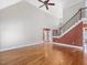 Bright and expansive living room with hardwood floors, staircase, and tall ceilings provide an airy and elegant living space at 1008 Maduro Ct, Zebulon, NC 27597