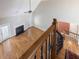 Sun-filled living room features hardwood floors, a fireplace, and stairs to the second level at 1008 Maduro Ct, Zebulon, NC 27597