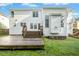 Spacious backyard featuring a wooden deck and easy access to the home's interior at 102 Cockleshell Ct, Cary, NC 27513
