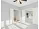 Bright bedroom with a ceiling fan and carpeted floor at 102 Cockleshell Ct, Cary, NC 27513