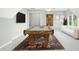 Finished bonus room with a pool table and comfortable sofa at 102 Cockleshell Ct, Cary, NC 27513