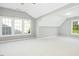 Spacious bonus room featuring multiple windows for natural light at 102 Cockleshell Ct, Cary, NC 27513