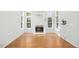 Bright living room with hardwood floors, fireplace, and abundant natural light streaming through multiple windows at 102 Cockleshell Ct, Cary, NC 27513