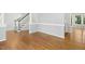 Open living room showcases hardwood floors and staircase at 102 Cockleshell Ct, Cary, NC 27513