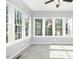 Sunroom with carpet, large windows, and natural light at 102 Cockleshell Ct, Cary, NC 27513