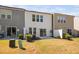 This backyard features a patio and backs up to a wooded area for privacy at 1020 Sycaten St, Durham, NC 27703