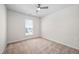 This cozy bedroom is equipped with a ceiling fan and plush carpet for comfort at 1020 Sycaten St, Durham, NC 27703