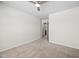 Bedroom featuring carpet flooring, a ceiling fan, and an adjoining bathroom for convenience at 1020 Sycaten St, Durham, NC 27703