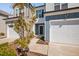 Inviting townhome entrance features a garage, landscaping, and a well-maintained walkway for curb appeal at 1020 Sycaten St, Durham, NC 27703
