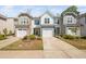 Inviting townhome exterior features a garage, landscaping, and a well-maintained lawn for curb appeal at 1020 Sycaten St, Durham, NC 27703