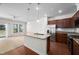 Kitchen with an island, granite countertops, stainless steel appliances, and a view of the backyard at 1020 Sycaten St, Durham, NC 27703