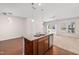 Kitchen island with double sink and granite countertops overlooks the home's sliding glass doors and backyard at 1020 Sycaten St, Durham, NC 27703