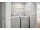 Laundry room featuring a modern washer and dryer setup, with ample storage space at 1020 Sycaten St, Durham, NC 27703