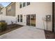 This backyard has a concrete patio with a sliding glass door to the home at 1020 Sycaten St, Durham, NC 27703