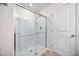 Shower with a glass door, built-in shelves, and bright lighting for a clean and modern look at 1020 Sycaten St, Durham, NC 27703