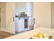 A bar area features a wine fridge, decorative accents and natural light at 107 Hillcrest Ave # C And D, Carrboro, NC 27510