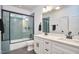 Modern bathroom with double sink vanity, large mirror, tiled shower with glass doors, and sleek finishes at 107 Hillcrest Ave # C And D, Carrboro, NC 27510