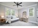 Comfortable bedroom featuring a large window with natural light, ceiling fan, and built-in daybed with gray drawers at 107 Hillcrest Ave # C And D, Carrboro, NC 27510