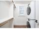 Walk-in closet includes shelving and stacked washer/dryer at 107 Hillcrest Ave # C And D, Carrboro, NC 27510
