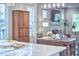 Dining room features a large dining table, armoire, and fireplace with access to the kitchen at 107 Hillcrest Ave # C And D, Carrboro, NC 27510