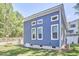 Back exterior of a home with blue siding and well-maintained landscaping at 107 Hillcrest Ave # C And D, Carrboro, NC 27510