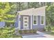 Charming blue home features a modern design with a white trim and well-manicured landscaping at 107 Hillcrest Ave # C And D, Carrboro, NC 27510