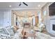 Cozy living room featuring hardwood floors, modern ceiling fan, and an open layout connecting the living space with the kitchen at 107 Hillcrest Ave # C And D, Carrboro, NC 27510