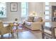 Comfortable seating in a bright living room featuring a modern fireplace, hardwood floors, and natural light from windows and glass door at 107 Hillcrest Ave # C And D, Carrboro, NC 27510