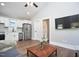 Bright open-concept space featuring a kitchen, living room with hardwood floors and modern fixtures at 107 Hillcrest Ave # C And D, Carrboro, NC 27510