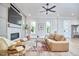Bright and open living room featuring a modern fireplace, hardwood floors, comfortable seating, and natural light from large windows at 107 Hillcrest Ave # C And D, Carrboro, NC 27510