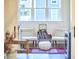 A sitting room features a record player, comfortable seating, a patterned rug and natural light at 107 Hillcrest Ave # C And D, Carrboro, NC 27510