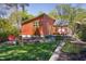 Inviting backyard with modern siding, firepit area, and lush green lawn, a perfect outdoor retreat at 1109 Huntington Ave, Durham, NC 27707