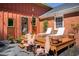 Charming backyard deck featuring lounge chairs, decorative accents, and inviting outdoor space for entertaining at 1109 Huntington Ave, Durham, NC 27707