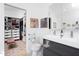 Modern bathroom with a double vanity and a walk-in closet at 1109 Huntington Ave, Durham, NC 27707