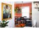 Stylish dining room with unique decor, plants, and a view into the living area at 1109 Huntington Ave, Durham, NC 27707