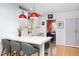 Bright, open kitchen area featuring an island, farmhouse sink and stainless steel appliances at 1109 Huntington Ave, Durham, NC 27707