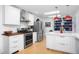 A spacious kitchen with stainless steel appliances, wooden countertops, and an island with seating at 1109 Huntington Ave, Durham, NC 27707