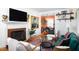 Comfortable living room flowing into a dining area, featuring a fireplace and stylish decor at 1109 Huntington Ave, Durham, NC 27707
