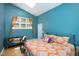 Stylish main bedroom with vaulted ceiling, skylight, sitting area, and colorful bedding at 1109 Huntington Ave, Durham, NC 27707