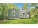 Cozy home featuring a well-maintained lawn and a charming deck perfect for relaxation and outdoor gatherings at 111 Dunstan Ave, Durham, NC 27707