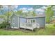 Home's backyard showcasing the exterior, deck, grass, and landscaping at 111 Dunstan Ave, Durham, NC 27707