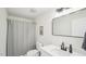 Bathroom featuring a modern vanity, a shower and tub combination with sleek fixtures at 111 Dunstan Ave, Durham, NC 27707